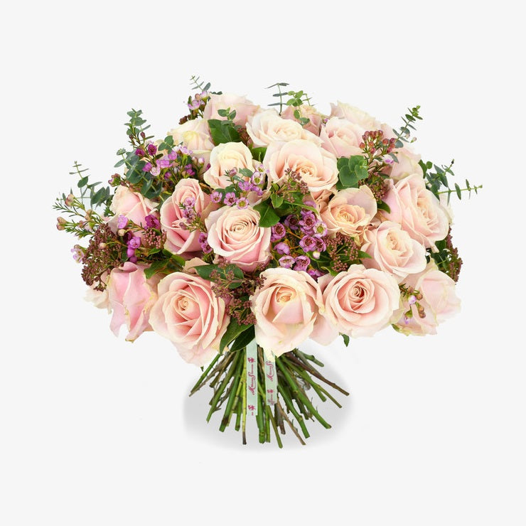 Pink delight luxury flower bouquet by Moyses Stevens UAE featuring pink roses, fragrant eucalyptus, and delicate pink wax flowers.