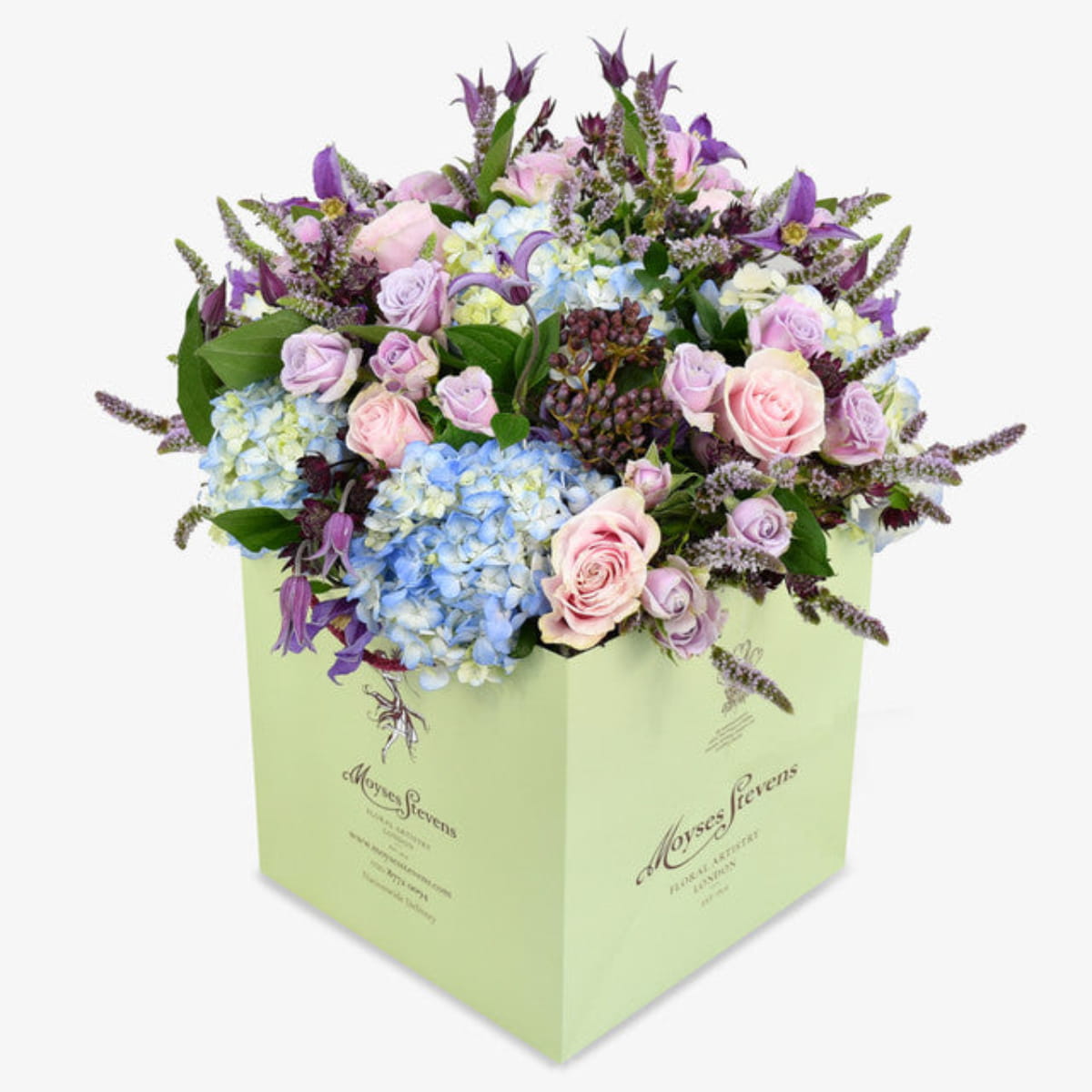 Wild Meadow luxury flower bouquet by Moyses Stevens UAE featuring Delicate lisianthus, roses, and ranunculus which are nestled among cymbidium orchids, while hydrangeas and astrantia provide a stunning backdrop.