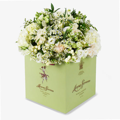 Event After In Mayfair luxury flower bouquet by Moyses Stevens UAE featuring pristine white roses and soft hydrangeas adding a touch of grandeur.