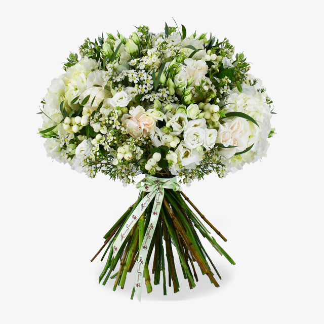 Event After In Mayfair luxury flower bouquet by Moyses Stevens UAE featuring pristine white roses and soft hydrangeas adding a touch of grandeur.