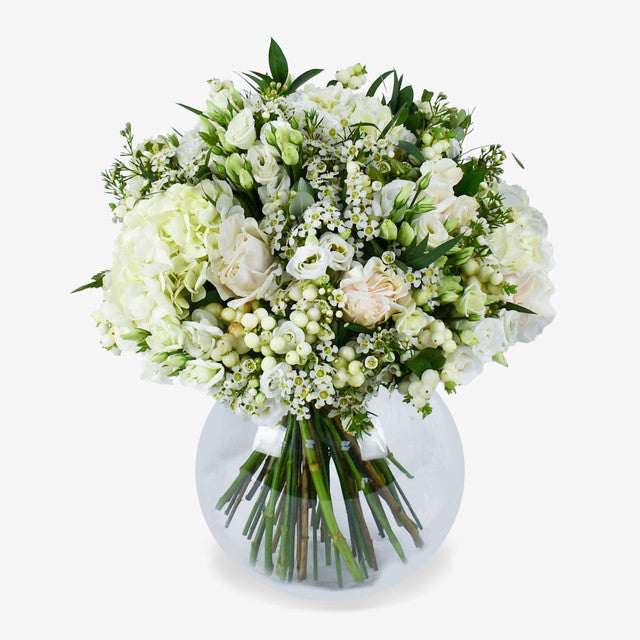 Event After In Mayfair luxury flower bouquet by Moyses Stevens UAE featuring pristine white roses and soft hydrangeas adding a touch of grandeur.