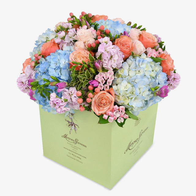 Blue dawn luxury flower bouquet by Moyses Stevens UAE featuring pink bouvardia, hypericum, spray roses, freesias and carnations to make the design truly irresistible