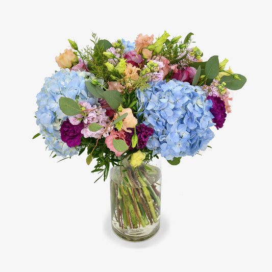 once in a blue moon luxury flower bouquet by Moyses Stevens UAE featuring Hydrangea, Roses, Lisianthus, Carnations, and Seasonal greenery