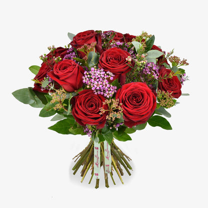 Dozen Red Roses luxury flower bouquet by Moyses Stevens UAE featuring red roses, pink wax flower, skimmia & eucalyptus