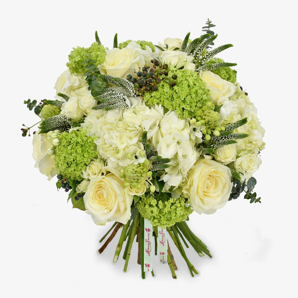 Graceful in White luxury flower bouquet by Moyses Stevens UAE featuring white hydrangeas, delicate spray roses and veronica with ornithogalum adding height and gentle movement to the arrangement. Finished with eucalyptus.