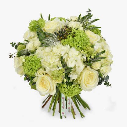 Graceful in White luxury flower bouquet by Moyses Stevens UAE featuring white hydrangeas, delicate spray roses and veronica with ornithogalum adding height and gentle movement to the arrangement. Finished with eucalyptus.