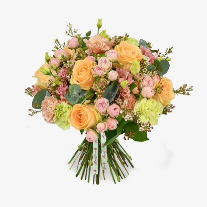 Just peachy luxury flower bouquet by Moyses Stevens UAE featuring a blend of peach and pink roses with eucalyptus and waxflower.