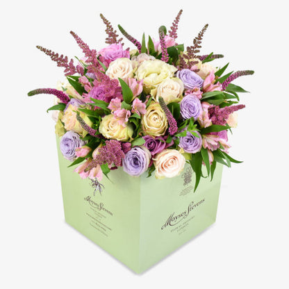Lavender sky luxury flower bouquet by Moyses Stevens UAE featuring Mixed Pastel Roses, Pink Astilbe, Pink Alstroemeria, Pink Veronica, Seasonal Foliage