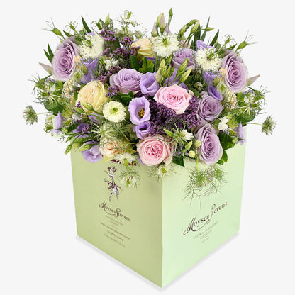 lilac charm luxury flower bouquet by Moyses Stevens UAE featuring pastel roses, lilac lisianthus and purple limonium.
