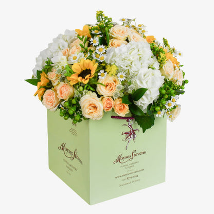 meadow delight luxury flower bouquet by Moyses Stevens UAE featuring Hydrangea, Sunflowers, Solidago, White Freesia, Tanacetum, Hypericum, Spray Roses, Astrantia