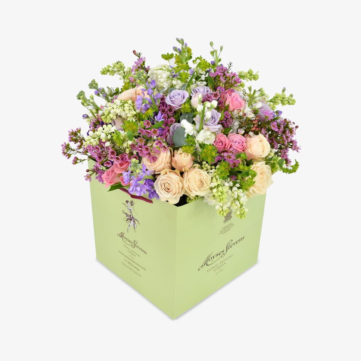 Mellow Meadow luxury flower bouquet by Moyses Stevens UAE featuring fragrant stocks, spray roses, and eucalyptus. With the perfect touch of bold wax flower and vibrant green accents