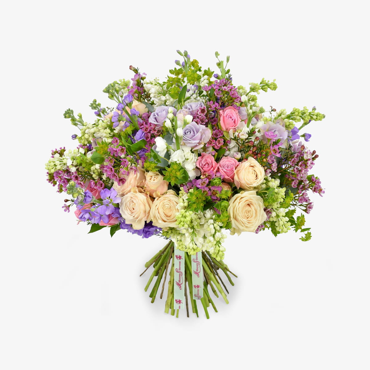Mellow Meadow luxury flower bouquet by Moyses Stevens UAE featuring fragrant stocks, spray roses, and eucalyptus. With the perfect touch of bold wax flower and vibrant green accents