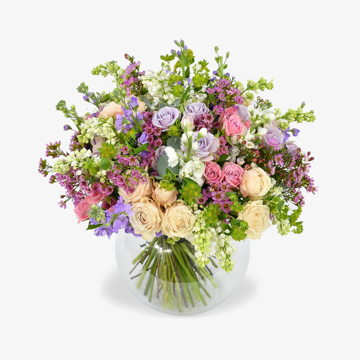 Mellow Meadow luxury flower bouquet by Moyses Stevens UAE featuring fragrant stocks, spray roses, and eucalyptus. With the perfect touch of bold wax flower and vibrant green accents