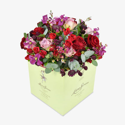 Rennaisance Rose luxury flower bouquet by Moyses Stevens UAE featuring a variety of red and pink roses, spray roses, clematis, wax flower, astrantia, and eucalyptus.