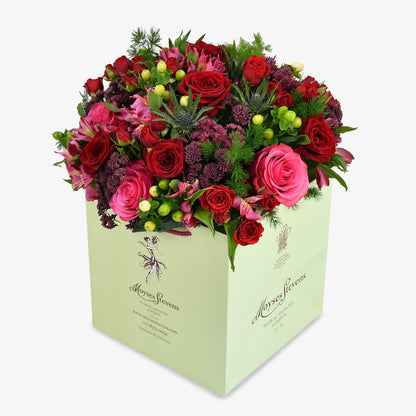 Sour Cherry luxury flower bouquet by Moyses Stevens UAE featuring rich crimson roses and velvety sedum for a deep, intense colour palette.