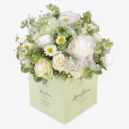 Summer Elegance luxury flower bouquet by Moyses Stevens UAE featuring pure white peonies, daisies, gypsophila, white roses and green and white pittosporum.