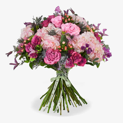 Café au Soleil luxury flower bouquet by Moyses Stevens UAE featuring Blues roses alongside the vibrant energy of hot pink spray roses and the dreamy softness of pink hydrangeas.