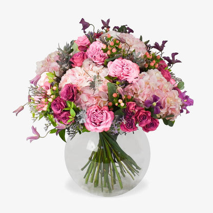 Café au Soleil luxury flower bouquet by Moyses Stevens UAE featuring Blues roses alongside the vibrant energy of hot pink spray roses and the dreamy softness of pink hydrangeas.