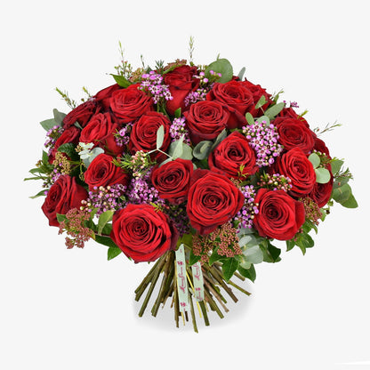 three dozen red roses luxury flower bouquet by Moyses Stevens UAE featuring Roses, Waxflower, Viburnum, Eucalyptus