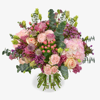 Waxflower and rose luxury flower bouquet by Moyses Stevens UAE featuring wax flower, roses, eucalyptus, lisianthus, astrantia, and hydrangeas.